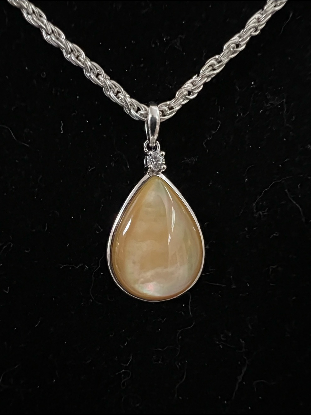 Teardrop Mother-of-Pearl Pendant Necklace in Cream and Silver With CZ Accent.